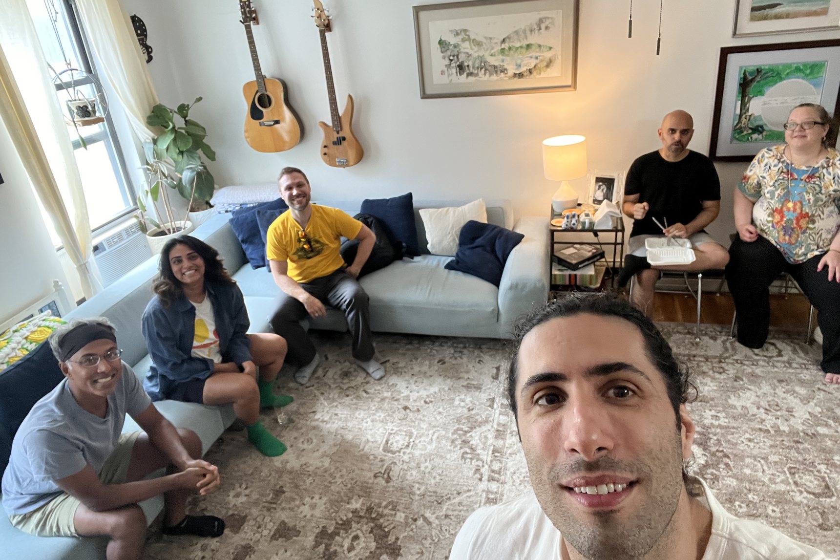 A group sitting together in a Brooklyn living room